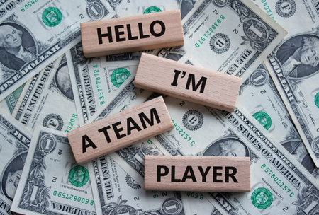 Hello I am a team player symbol. Concept words Hello I am a team player on wooden blocks. Beautiful...