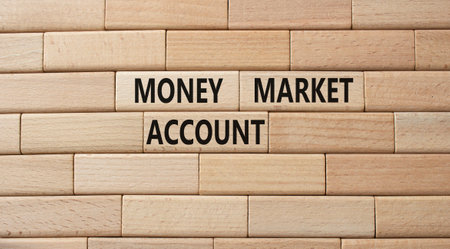 Money Market Account symbol. Wooden blocks with words Money Market Account. Beautiful wooden background. Business and Money Market Account concept. Copy space.の写真素材