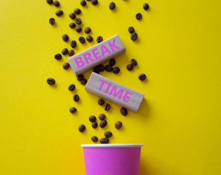 Break Time symbol. Concept word Break Time on wooden blocks. Beautiful yellow background with coffee...