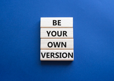 Be your own version symbol. Concept words Be your own version on wooden blocks. Beautiful deep blue background. Business and Be your own version concept. Copy spaceの写真素材