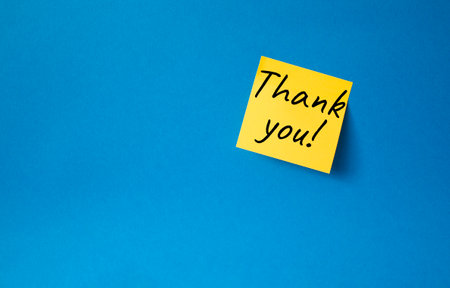 Thank you symbol. Steaky notes with words Thank you. Beautiful blue background. Business and Thank you concept. Copy space.の写真素材