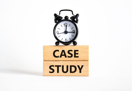 Case Study symbol. Wooden blocks with words Case Study. Beautiful white background with alarm clock....