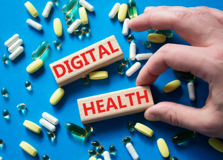 Digital Health symbol. Concept word Digital Health on wooden blocks. Doctor Hand. Beautiful blue background with pills. Medicine and Digital Health concept. Copy spaceの写真素材