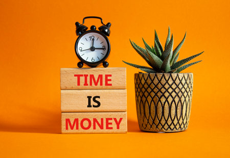 Time is Money symbol. Concept words Time is Money on wooden blocks. Beautiful orange background with alarm clock and succulent plant. Business and Time is Money concept. Copy spaceの写真素材