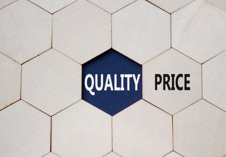 Price or Quality symbol. Concept word Price or Quality on wooden comb puzzle. Beautiful deep blue background. Business and Price or Quality concept. Copy spaceの写真素材