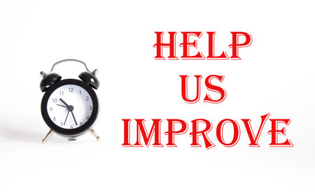 Help Us Improve symbol. Concept word Help Us Improve on Beautiful white background with alarm clock. Business and Help Us Improve concept. Copy spaceの写真素材