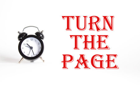 Turn the Page symbol. Concept words Turn the Page on Beautiful white background with alarm clock....