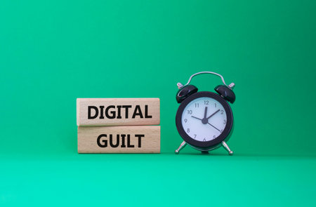 Digital Guilt symbol. Concept words Digital Guilt on wooden blocks. Beautiful green background with...