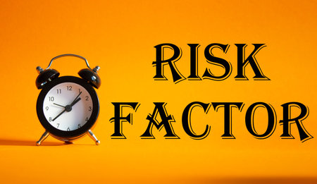 Risk Factor symbol. Concept words Risk Factor on Beautiful orange background with alarm clock....