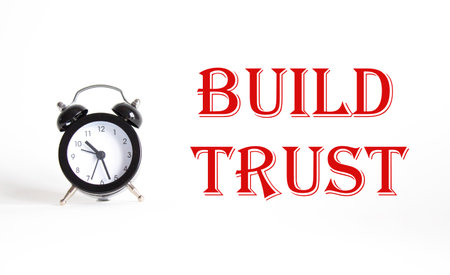 Build trust symbol. Beautiful white background with alarm clock. Business and Build trust concept. Copy space.の写真素材