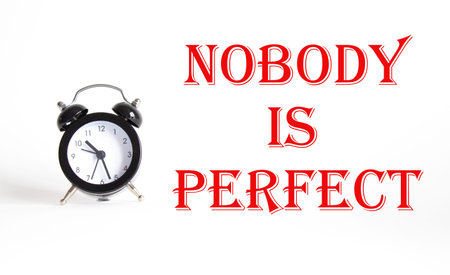 Nobody is Perfect symbol. Concept word Nobody is Perfect on Beautiful white background with alarm...