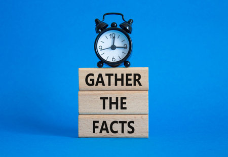 Gather the facts symbol. Wooden blocks with words Gather the facts. Beautiful blue background with...