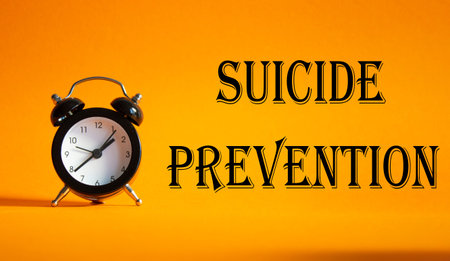 Suicide Prevention symbol. Concept words Suicide Prevention on Beautiful orange background with...