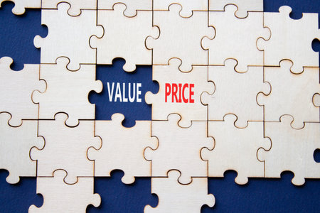 Price and Value symbol. Concept word Price and Value on wooden puzzle. Beautiful deep blue...