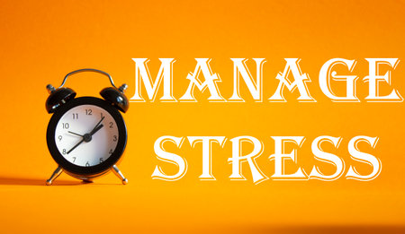 Manage stress symbol. Concept word Manage stress on Beautiful orange background with alarm clock. Medicine and Management stress concept. Copy spaceの写真素材