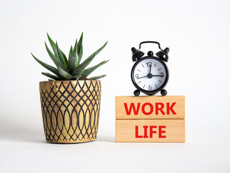 Work Life symbol. Concept word Work Life on wooden blocks. Beautiful white background with alarm clock and succulent plant. Business and Work Life concept. Copy spaceの写真素材