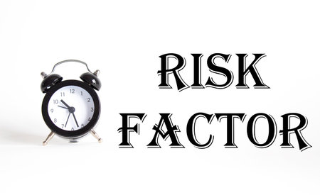 Risk Factor symbol. Concept words Risk Factor on Beautiful white background with alarm clock. Business and Risk Factor concept. Copy space.の写真素材