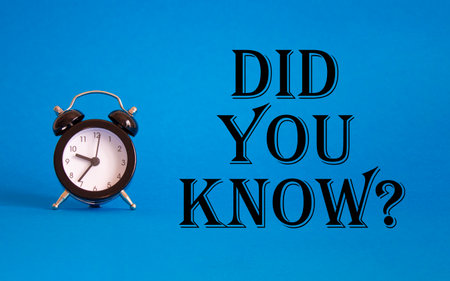 Did you know symbol. Beautiful blue background with alarm clock. Business and Did you know concept. Copy space.の写真素材