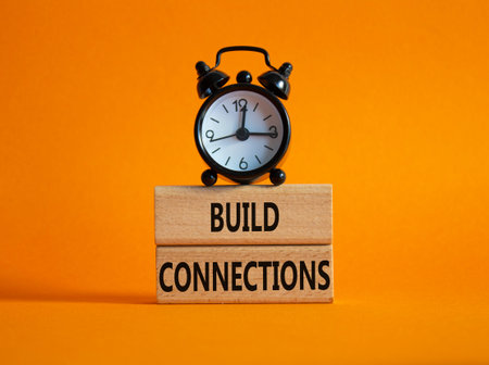 Build Connections symbol. Concept word Build Connections on wooden blocks. Beautiful orange...