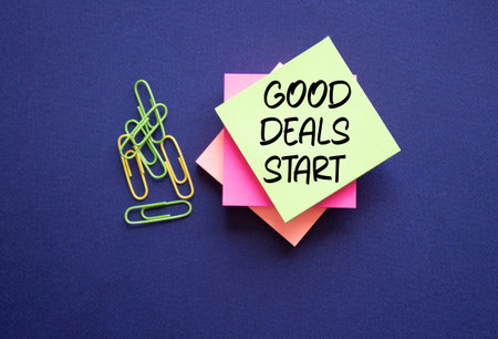 Good Deals Start symbol. Sticky Notes with words Good Deals Start. Beautiful deep blue background....