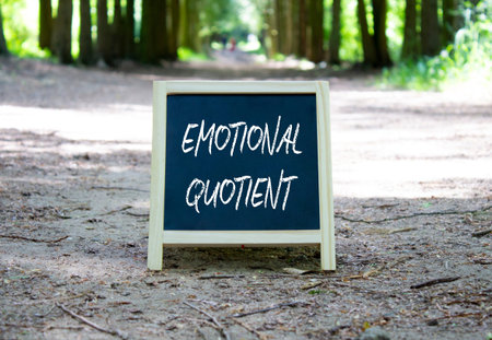 Emotional Quotient symbol. Concept word Emotional Quotient on chalk blackboard. Beautiful forest...
