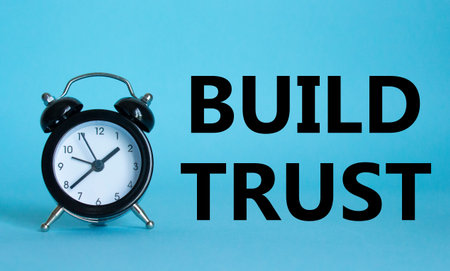 Build trust symbol. Beautiful blue background with alarm clock. Business and Build trust concept....