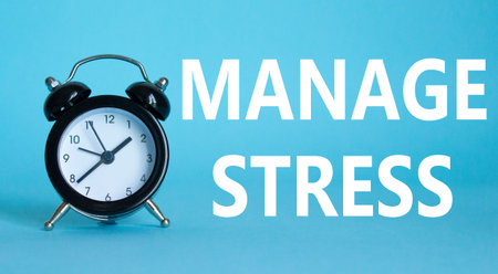 Manage stress symbol. Concept word Manage stress on Beautiful blue background with alarm clock....