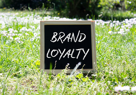 Brand Loyalty symbol. Concept word Brand Loyalty on chalk blackboard. Beautiful meadow background. Business and Brand Loyalty concept. Copy space.の写真素材