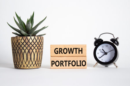 Growth Portfolio symbol. Concept word Growth Portfolio on wooden blocks. Beautiful white background with alarm clock and succulent plant. Business and Growth Portfolio concept. Copy spaceの写真素材