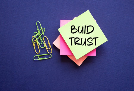 Build trust symbol. Build trust on sticky note. Beautiful deep blue background. Business and Build trust concept. Copy space.の写真素材