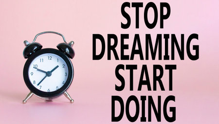 Stop Dreaming Start Doing symbol. Beautiful pink background with alarm clock. Business and Stop...