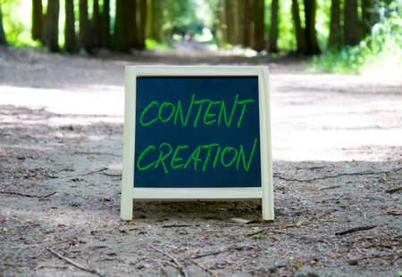 Content creation symbol. Concept word Content creation on chalk blackboard. Beautiful forest...
