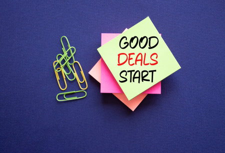 Good Deals Start symbol. Sticky Notes with words Good Deals Start. Beautiful deep blue background. Business and Good Deals Start concept. Copy space.の写真素材