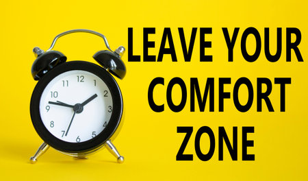 Leave your Comfort Zone symbol. Beautiful yellow background with alarm clock. Business and Leave...