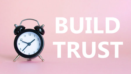 Build trust symbol. Beautiful pink background with alarm clock. Business and Build trust concept. Copy space.の写真素材