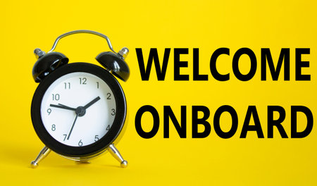 Welcome onboard symbol. Concept words Welcome onboard on Beautiful yellow background with alarm...