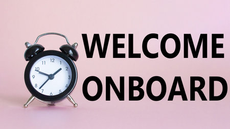 Welcome onboard symbol. Concept words Welcome onboard on Beautiful pink background with alarm clock....
