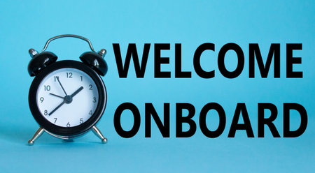 Welcome onboard symbol. Concept words Welcome onboard on Beautiful blue background with alarm clock....