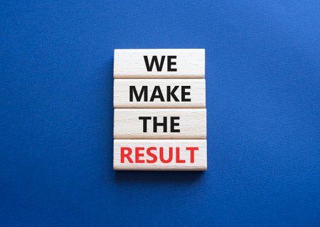 We make the result symbol. Concept words We make the result on wooden blocks. Beautiful deep blue background. Business concept. Copy space.の写真素材