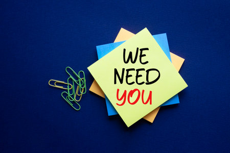 We need you symbol. Concept words We need you on sticky. Beautiful deep blue background. Business and We need you concept. Copy space.の写真素材
