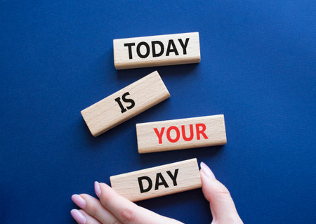 Today is Your Day symbol. Wooden blocks with words Today is Your Day. Businessman hand. Beautiful deep blue background. Business and Today is Your Day. Copy space.の写真素材