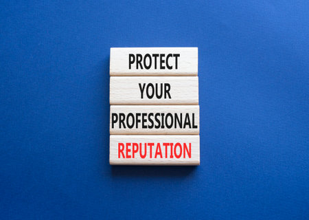 Professional Reputation symbol. Concept words Protect Your Professional Reputation on wooden blocks. Beautiful deep blue background. Business concept. Copy spaceの写真素材