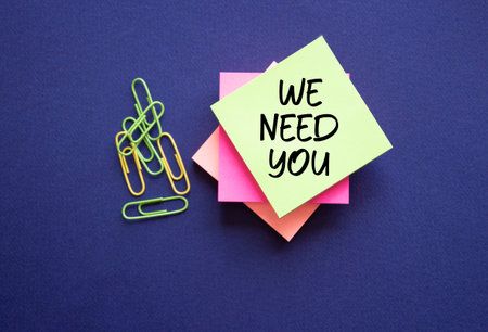 We need you symbol. Concept words We need you on sticky notes. Beautiful deep blue background. Business and We need you concept. Copy space.の写真素材