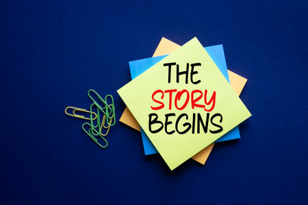 The Story Begins symbol. Sticky notes with words The Story Begins. Beautiful deep blue background. Business and The Story Begins concept. Copy space.の写真素材