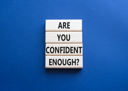 Confidence symbol. Wooden blocks with words Are you confident enough. Beautiful deep blue background. Business and Are you confident enough concept. Copy space.の写真素材
