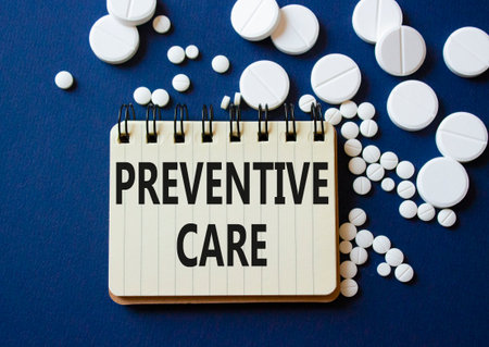 Preventive Care symbol. Concept word Preventive Care on notebook. Beautiful deep blue background with pills. Medicine and Preventive Care concept. Copy spaceの写真素材