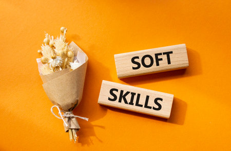 Soft skills symbol. Wooden blocks with words Soft skills. Beautiful orange background. Business and Soft skills concept. Copy space.の写真素材