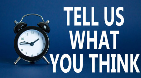 Tell us what you think symbol. Wooden blocks with words Tell us what you think. Beautiful deep blue...