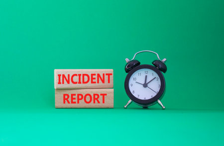 Incident Report symbol. Concept word Incident Report on wooden blocks. Beautiful green background. Business and Incident Report concept. Copy spaceの写真素材