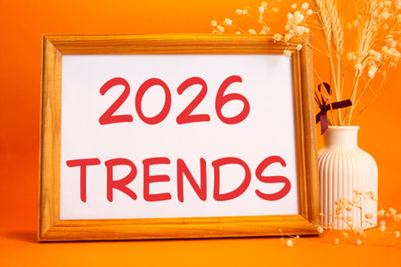 2026 Trends symbol. Concept words 2026 Trends on beautiful wooden picture frame. Beautiful orange...